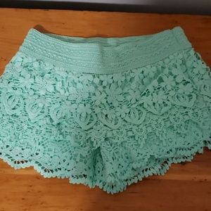 Mint green shorts/ black shorts